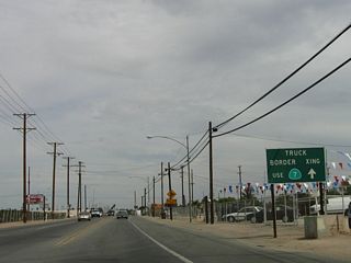 This sign on eastbound California 98 is for the truck border crossing via California 7. California 7 is the short route between California 98 and the newest port of entry between Calexico and Mexicali. It is located east of Calexico.
