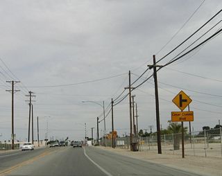 Prior to the railroad crossing, the next right turn is for Cesar Chavez Boulevard. Use Cesar Chavez Boulevard south as an alternative to California 111 en route to the international border.