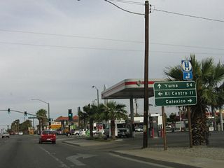 A California 111 shield is positioned on this directional sign, along with California 98.