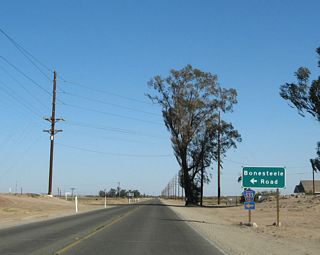 Eastbound California 98 approaches Imperial County Route S-33, Bonesteele Road. From here, Imperial County Route S-33 travels north on Bonesteele Road, Miller Road, and Highline Road to California 78 at Brunts Corner.