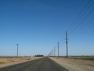 California 98 continues east as it passes through more agricultural fields.