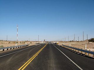 After making the turn, California 98 crosses the East Highline Canal, which diverges from the All-American Canal just south of here. This bridge was originally constructed in 1939 and was reconstructed in 2006, which resulted in temporary closures of this section of California 98 during the construction period.