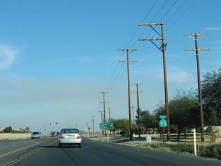 Now leaving urban Calexico, a reassurance shield and mileage sign is posted on eastbound California 98.