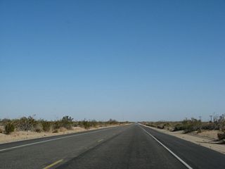 The two-lane highway enters a terrain devoid of human development except for the canal and powerlines to the south. Much of this land is part of the East Mesa, which brings us out of the Imperial Valley and toward the Algodones Dunes.  This land is not nearly as fertile as the lowlands of the Imperial Valley. Watch for the soft, sandy shoulder when stopping along this stretch of highway.