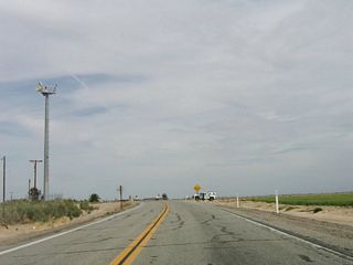 A U.S. Border Patrol vehicle, which is commonly seen along California 98, is parked on the shoulder of the highway near the Westside Canal.