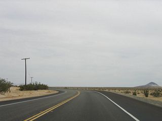 Afterward, the highway turns again toward the south and then to the east. This area is known as the Yuha Desert, and it is part of federally owned Bureau of Land Management (BLM) holdings. Plants are not as common as in other parts of the desert due to the rainshadow effect caused by the nearby Cuyamaca Mountains.