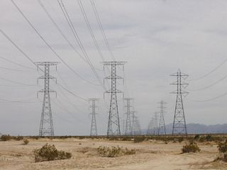 Near the eastern edge of the Yuha Desert, these 230kV power lines carry electricity from Mexico into the United States. The power line on the right is managed by San Diego Gas & Electric and is known as the Imperial Valley-La Rosita Line, named after the two substations it connects. It was constructed prior to the other two lines. La Rosita is the name for both a substation and a power plant in Mexico; this older line connects to the substation. The other two power lines were constructed in late 2001 and early 2002 by Intergen and Sempra. These lines added capacity between new power generation facilities and the United States transmission grid.