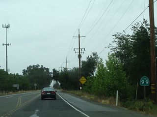 Another California 99 north route marker is posted after the B Street intersection.