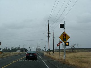 The northern intersection between California 99 and California 162 is governed by a traffic signal, which was not in place in 2003 but was fully functional by 2008.