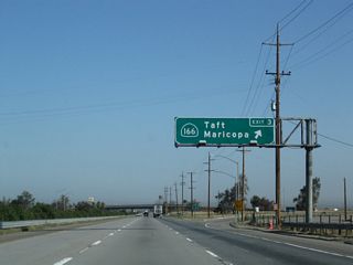 Northbound California 99 (Golden State Highway) meets Exit 3, California 166. This marks the eastern terminus of California 166. A roadside guide sign for Mettler in 2004 was gone by 2006. This trumpet interchange only connects to California 166 west; there is no local road east of here.