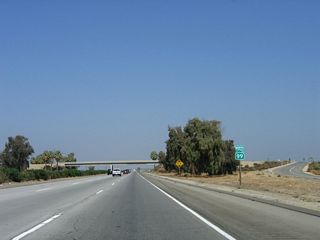 A California 99 north confirming marker is posted after the off-ramp to Exit 7, Sandrini Road.