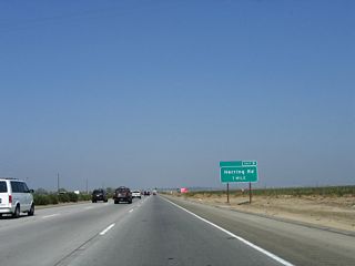 The next exit along northbound is Herring Road, which leads west across the Kern Lake Bed before meeting Old River Road west of Interstate 5.