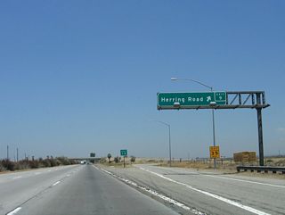 Northbound California 99 (Golden State Highway) meets Exit 9, Herring Road.