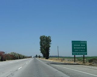 The next interchange along California 99 north is Exit 11, California 99 Business (Union Avenue) north to Greenfield and Bakersfield.  California 99 Business follows the original alignment of U.S. 99 as it splits away from the freeway to the north, while the freeway angles a bit to the northwest. Initially, the business route and freeway remain very close to one another; in fact, two miles north of here, westbound California 223 meets the business route just before ascending the overpass over California 99.
