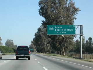 The next interchange along California 99 north is Exit 13, California 223 (Bear Mountain Boulevard) east to Arvin and west to Interstate 5.