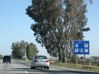 Most motorist services are available at Exit 13. It was revised to include the exit number.