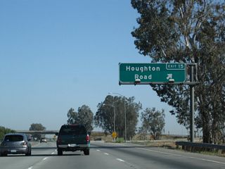 Northbound California 99 meets Exit 15, Houghton Road.