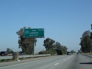 California 119 (Taft Highway) heads west to Taft, while unsigned Panama Road (not to be confused with Exit 20, Panama Lane) leads east to Lamont and California 184.