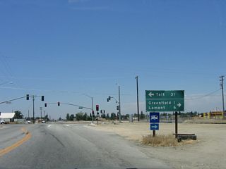 A mileage sign is posted at the traffic signal between H Street and Taft Highway. California 119 (and Historic U.S. 399) leads west to Taft, which is 31 miles west of here.