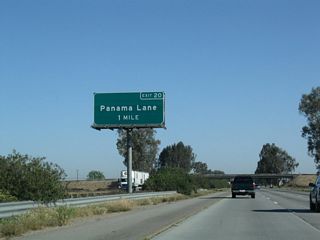 The next exit along northbound California 99 (Golden State Highway) is Exit 20, Panama Lane. The overhead sign was changed, along with most of the others along this stretch of California 99, to include the exit number.