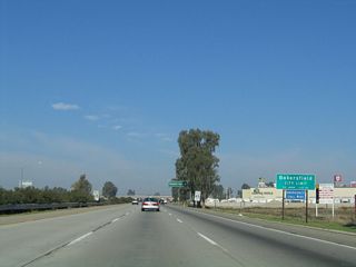 Just prior to the off-ramp for Exit 20 (Panama Lane), California 99 enters its first city: Bakersfield. The city had a population of 347,483 as of the 2010 Census after several decades of explosive growth that has tripled the population since 1980 (the 1980 Census had a population of 105,611 for Bakersfield). Downtown Bakersfield is best accessed via Exit 25 (California Avenue) and sits at an elevation of 408 feet. Located about 110 miles north of Los Angeles and 110 miles south of Fresno, Bakersfield anchors the southern Central Valley. With a history rich in oil discovery, Bakersfield is also a major agricultural area that receives an average of a little less than six and a half inches of precipitation annually. The city was incorporated on January 11, 1898.