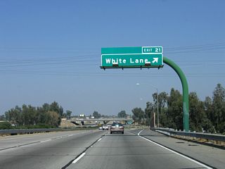 Northbound California 99 meets Exit 21, White Lane.