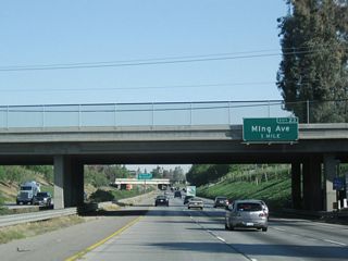 The next exit along northbound is Exit 23, Ming Avenue. This sign was also replaced by 2009.