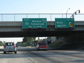 Northbound California 99 (Golden State Highway) meets Exit 23, Ming Avenue. The next exit is Exit 24, California 58 east to Tehachapi, Mojave, and Barstow. California 58 is a major east-west state route through Kern County. Traffic demands have required assorted upgrades to California 58 to where the entire route from Bakersfield to Barstow has been upgraded to freeway or expressway standards excepting sections near Kramers Junction (U.S. 395/Four Corners). An east-west freeway connection between California 99 and Interstate 5 is currently being planned in Bakersfield (Westside Parkway), and once the route is determined, it is possible that it might carry the California 58 designation, pending a connection between this freeway and the state highway network.