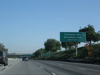 Use Exit 24 to reach Stockdale Highway and Brundage Lane. Stockdale Highway heads west from Bakersfield toward Interstate 5, and Brundage Lane heads east, parallel to California 58. Ahead, California 58 west will follow California 99 north for a couple miles.