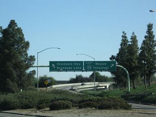 This view shows the off-ramp from California 99 north to California 58 east, Stockdale Highway west, and Brundage Lane east (the latter two are via a connection along Wible Road.