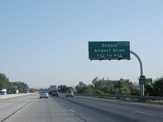 The next exit along California 99 north is Exit 27, Airport Drive to Oildale (three-quarters of a mile). This exit provides access to Meadows Field airport and the aptly named Oildale, which is located on the north side of the Kern River and is adjacent to the sprawling Kern River oil field. An entire hillside on the north bank of the river is covered with oil derricks and related industrial facilities.