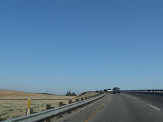 California 99 splits into two separate carriageways for the passage over the Union Pacific Railroad, which will switch sides from the west side of the freeway to the east side of the freeway.
