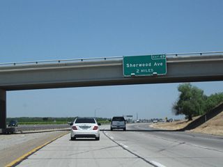 The next exit along California 99 north is Exit 49, Sherwood Avenue/McFarland (two miles). It is rare to find an advance sign for more than one mile along California 99.