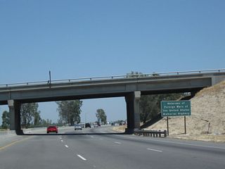 California 99 is designated as the Veterans of Foreign Wars of the United States Memorial Highway, as evidenced by this roadside sign near the Pond Road overpass.
