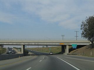 SR 99 (Golden State Highway) departs Kern County and enters Tulare County at the County Line Road overpass. Leaving the petroleum-based industry and low-water agriculture of Kern County, the Central Valley rapidly becomes even more agricultural, thanks to imported water and a limited winter rainfall that slowly increases in annual totals as SR 99 ascends the Valley. Even this far north, rainfall is anything but plentiful, even though winter conditions may bring weeks of continuous "tule" fog that can hide the sun for extended periods and make driving along SR 99 challenging.