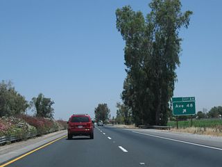 Northbound California 99 reaches Exit 64, Avenue 48 (Armstrong Avenue), State Street, and California 99 Business - Front Street north to Earlimart. The business route will return to California 99 at Avenue 56 (Exit 65). Front Street may had been signed as a business route at one time, but no signs remain as of 2010.