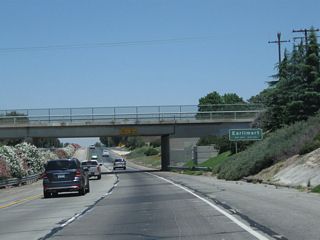 California 99 sees a brief below grade freeway segment as it passes through Earlimart and under the Avenue 48 (Armstrong Avenue) bridge.