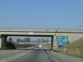 The next exit along California 99 north is Exit 70B, Court Street. This exit also serves Pixley. California 99 passes through this below-grade segment as it passes through Pixley in much the same way as Interstate 5 passes through Arbuckle in the Sacramento Valley.