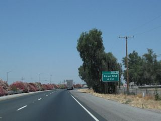 The next exit along California 99 north is Exit 71, Road 124 (Park Street) to Pixley Park. In Tulare County, all county roads are numbered into a grid system. "Roads" run north-south, while "Avenues" run east-west. Since California 99 passes through the area at a northeasterly trajectory, it intersects both Roads and Avenues. Road 124 travels due north from this interchange, while California 99 continues to aim northwest.