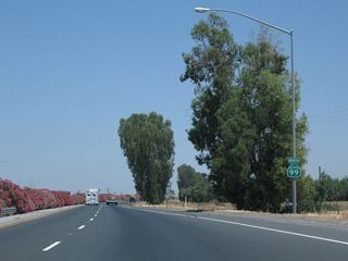 A California 99 confirming marker is posted after the on-ramp from Avenue 120. The next interchange is about three miles ahead.