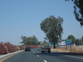 California 99 enters the unincorporated community of Tipton, which had a population of 2,543 as of the 2010 Census.
