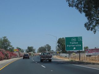 Northbound California 99 meets Exit 76, California 190 (Avenue 144). Once anticipated to extend east across the Sierra Nevada, California 190 is now two separate routes, with an eternally hopeful proposed extension across the mountains visible only on paper. Currently, California 190 extends east from here, passing through Poplar and Porterville en route to Camp Nelson in the foothills. Use California 190 east to Evans Road north into Tipton or Avenue 144 west to Historic U.S. 99/Burnett Road north into Tipton.