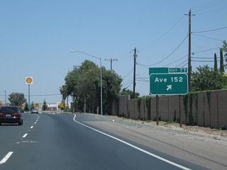 Northbound California 99 meets Exit 77, Avenue 152 (Olive Street) into Tipton.