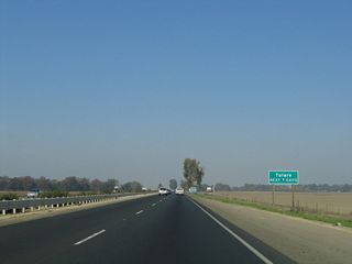 The next seven exits along northbound California 99 (Golden State Highway) serve the city of Tulare: Exit 83, Avenue 200 to California 99 Business (K Street) north to Tulare; defunct Exit 84, which used to connect directly to K Street via a left exit; Exit 85, Paige Avenue; Exit 86, Bardsley Avenue; Exit 87, California 137 (Tulare Avenue); Exit 88, Hillman Street and Prosperity Avenue; Exit 89, Cartmill Avenue; and Exit 90, Road 100 to Oaks Street south.