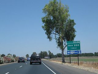 The next exit along California 99 north is Exit 83, Avenue 200 to California 99 Business (K Street) north (one mile). This is the first exit for the city of Tulare. Tulare, while not the seat of Tulare County, is a fast-growing community along the California 99 corridor. The city of Tulare had a population of 59,278 as of the 2010 Census and was incorporated on April 5, 1888.