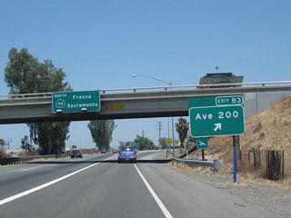Northbound California 99 meets Exit 83, Avenue 200. As seen in the background, the next exit is for K Street, the business route. K Street and J Street through Tulare may had been signed as a business route at one time, but few if any signs remain as of 2010.