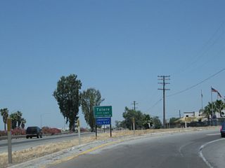 California 99 enters the city of Tulare at the point where the ramp to Avenue 200 (Exit 83) departs the freeway.