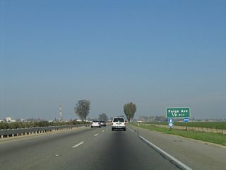 The next exit along California 99 north is Exit 85, Paige Avenue, one-half mile. Paige Avenue is an east-west street that serves the southern part of the city of Tulare, with connections to the International Agri-Center and Museum and Edison Ag-Tac.