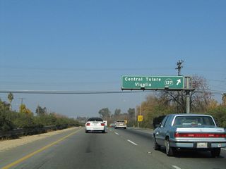 Northbound California 99 meets Exit 87, California 137 in Tulare. California 137 leads west to the city of Corcoran. It also leads east to meet California 65 near Lindsay.