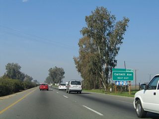 Cartmill Avenue travels west to meet California 99 Business (J Street) in northern Tulare and east to California 63.